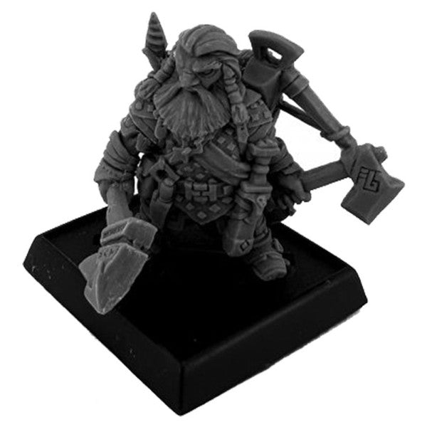 Gray figurine of a warrior with armor and weapons on a black base against a white background
